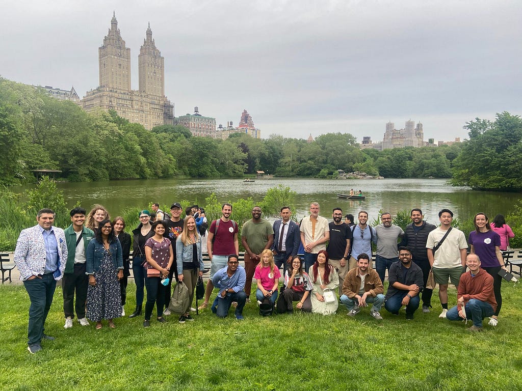 Around 30 people posing for a photo in central park as part of the UXDX USA walking tour