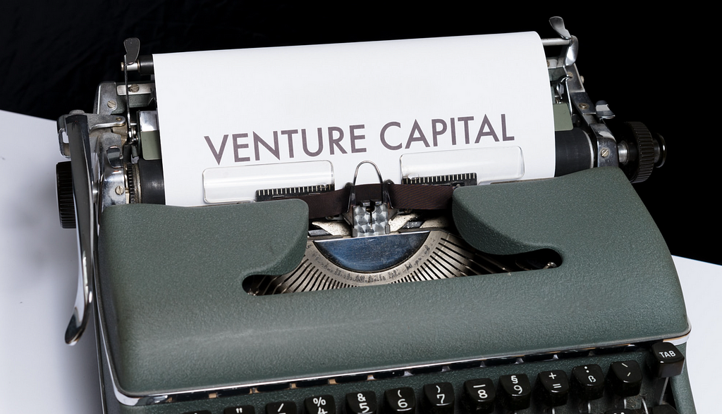 Venture Capital on paper in old typewriter