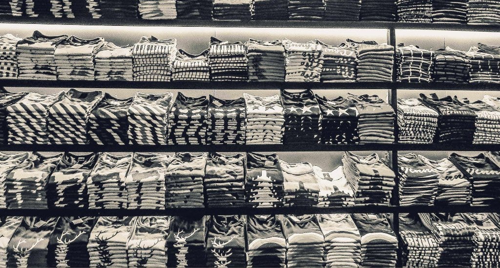 Folded T-Shirts on a store shelf 
