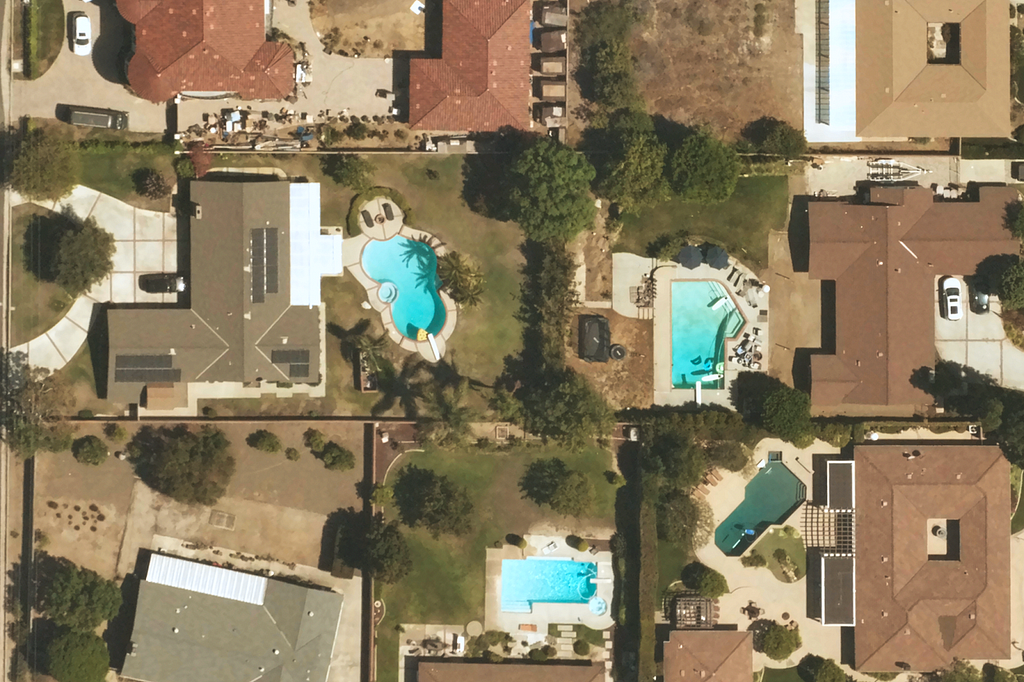 Near Space Labs high-resolution image of a neighborhood in California showing property details such as awnings, roof conditions, and swimming pools.