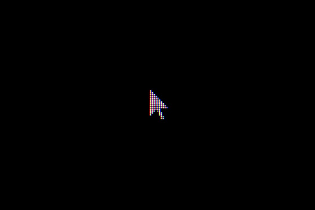 White pixelated cursor on a black background