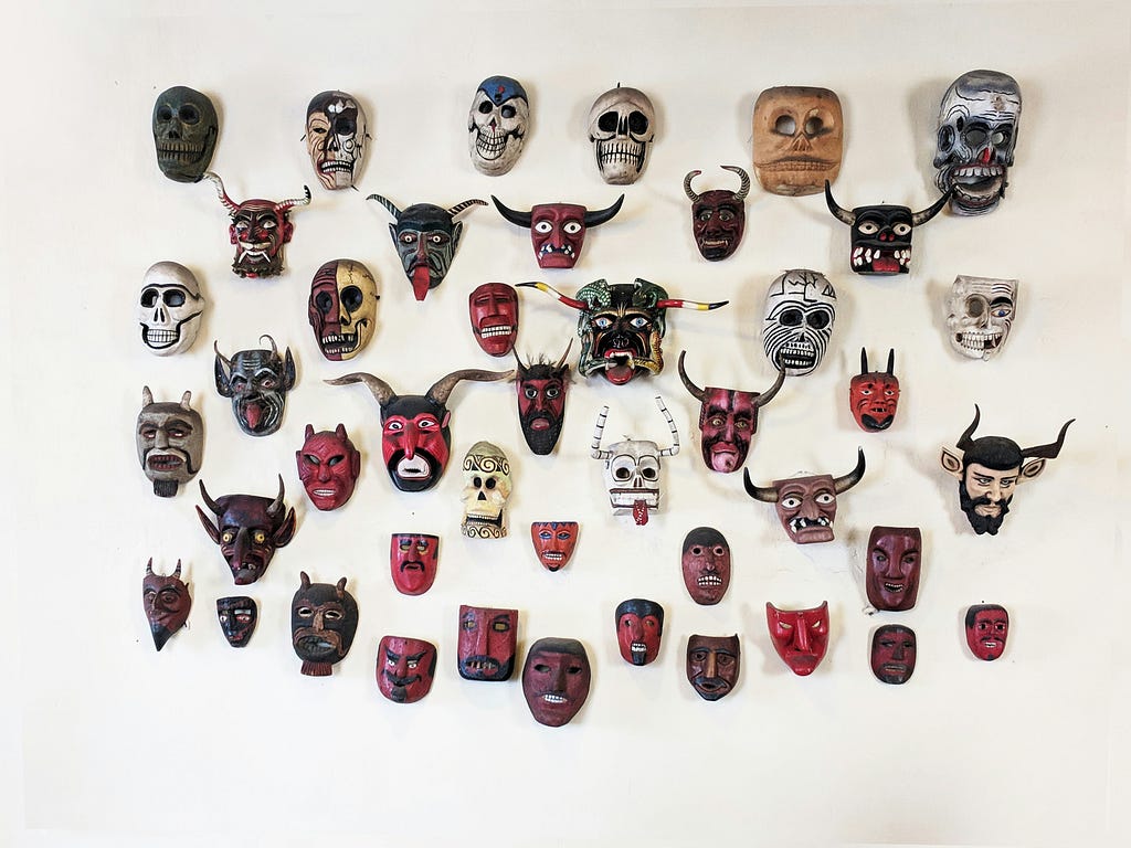 Wall covered in tribal masks