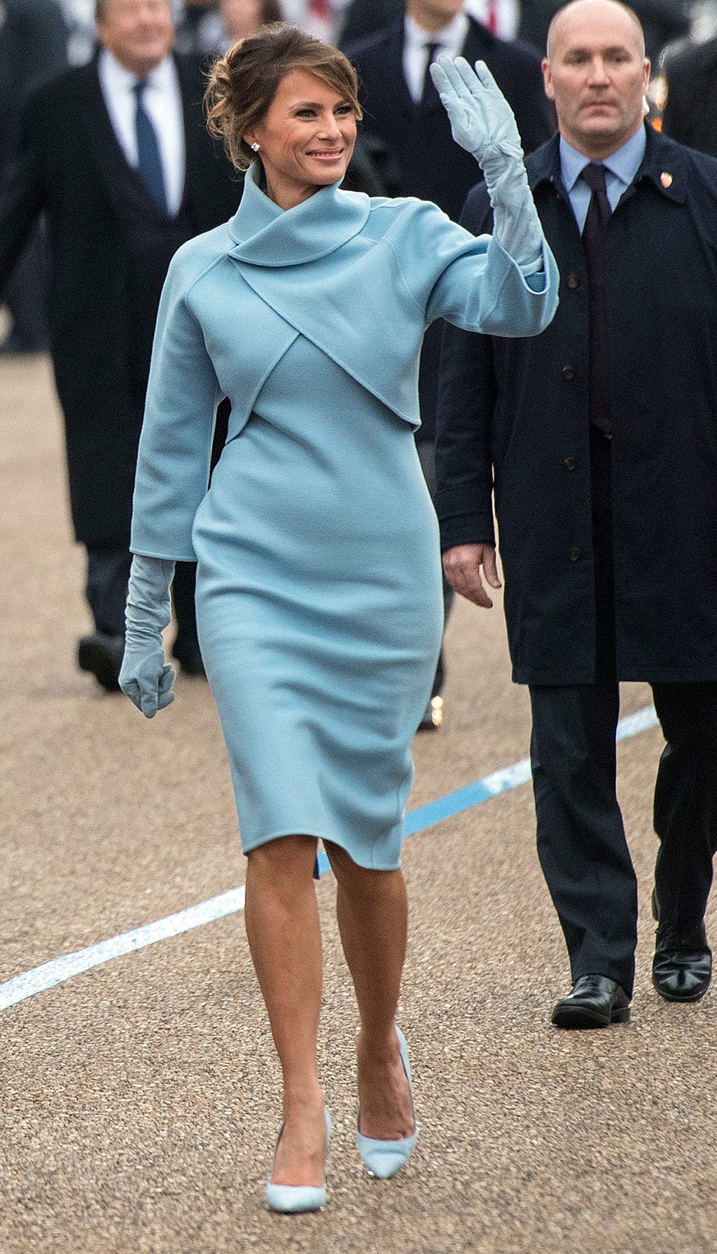 First lady Melania Trump waves to supporters in the inaugural parade on January 20, 2017, in Washington, DC.