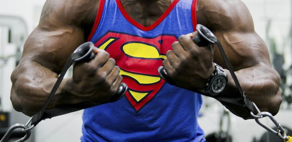 Man in Superman shirt working out