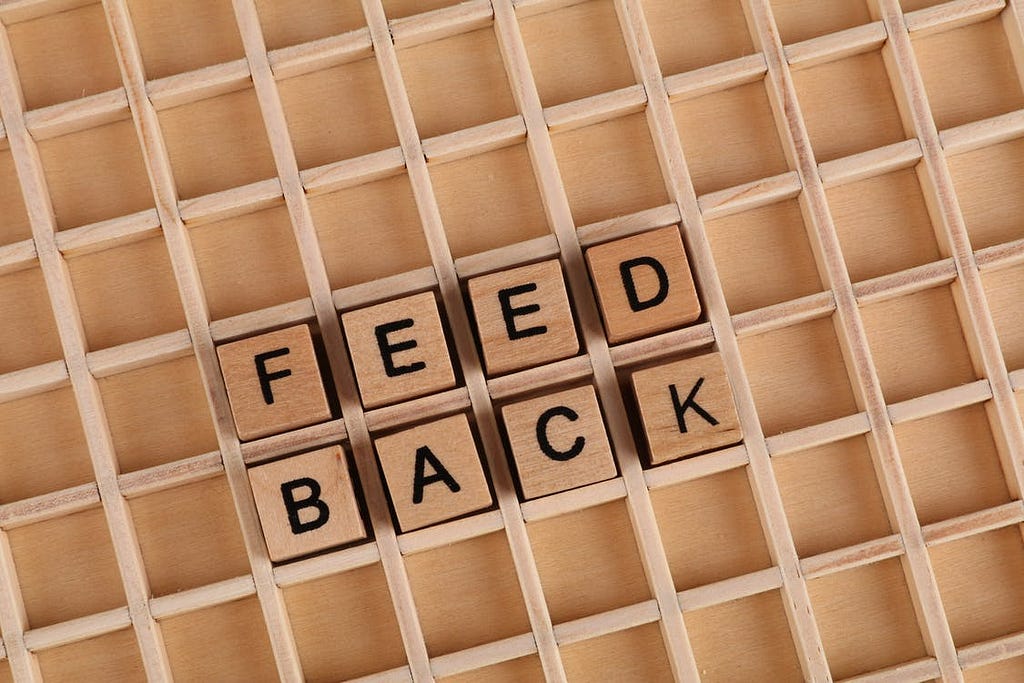 Stock art of letter blocks arranged in a way that spells out “feedback.”