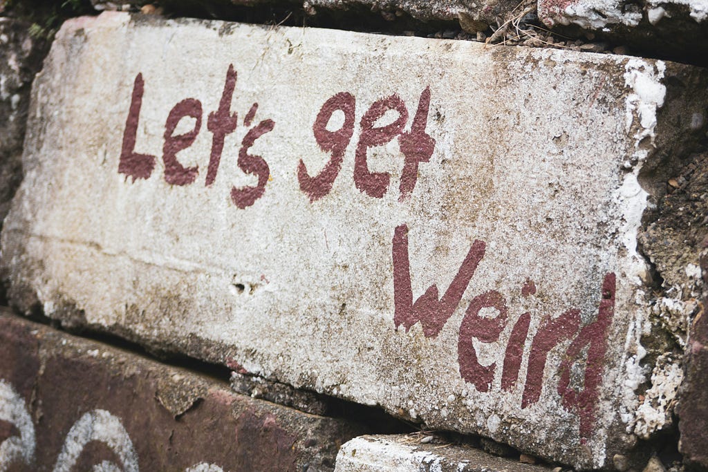 Sign that says “Let’s get weird”.