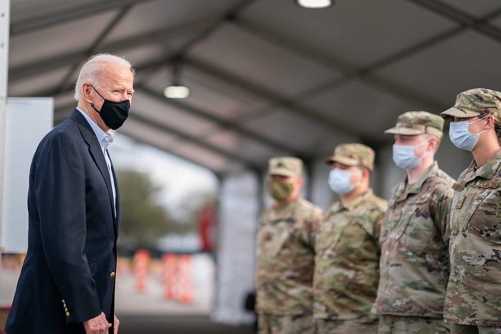 President Joe Biden greets members of the military at a FEMA COVID-19 vaccination site on Feb. 26, 2021, at NRG Stadium in Houston.