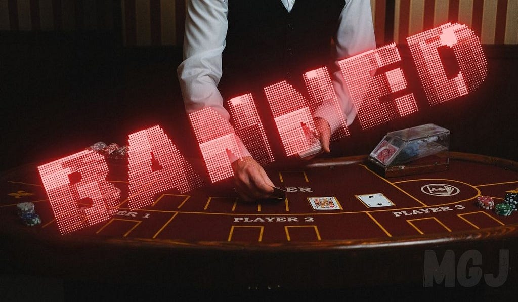 Banned from casinos — Dealer at casino with the word Banned written across the table