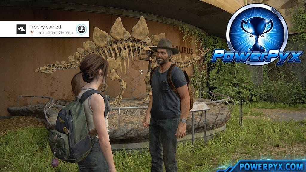 A trophy is unlocked as Ellie puts a hat on Joel, next to a dinosaur fossil.