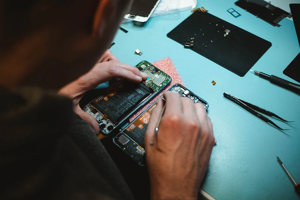 Man repairing mobile phone