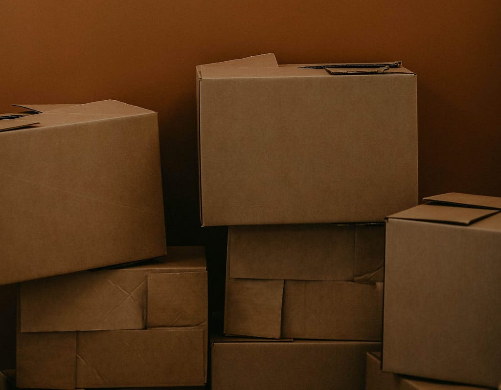 A pile of cardboard moving boxes