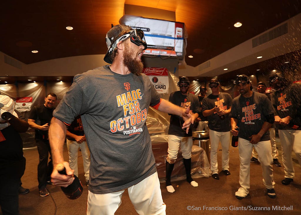 Hunter Pence gives a speech in the clubhouse.