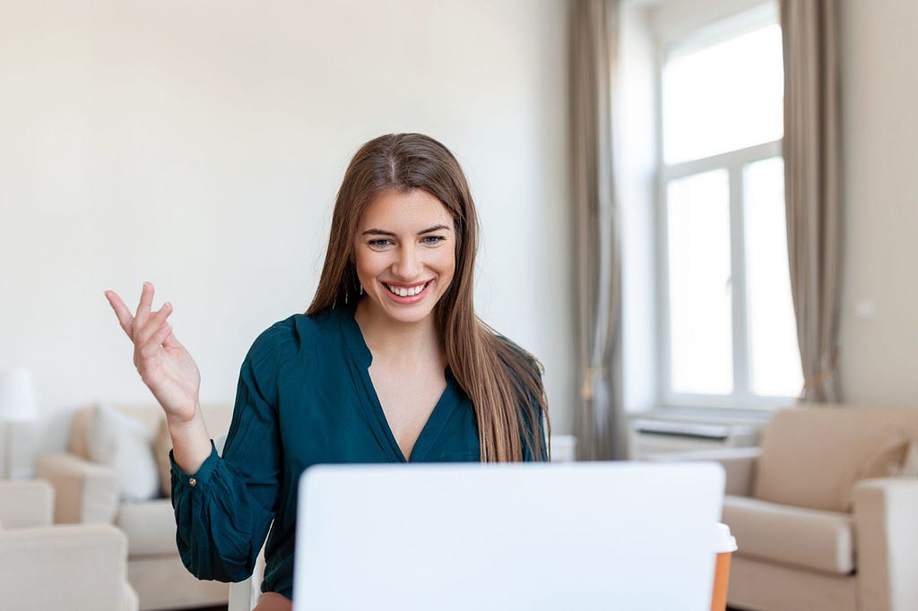 girl looking and smiling at the computer