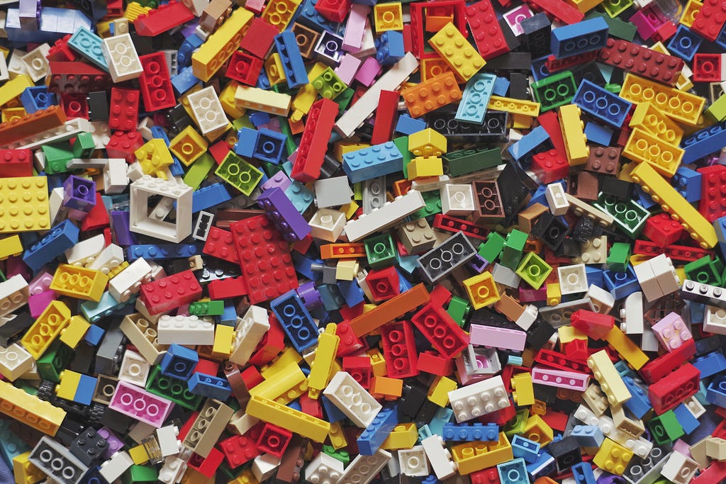 A pile of colorful legos separated into disarray