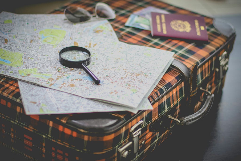 travel planning maps suitcase passport search