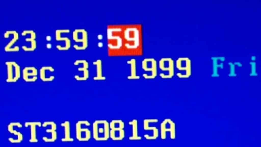 Illutration of an old school PC screen showing the date ad time just before changover from Dec 31 1999 23:50 to Jan 1 2000 00:00
