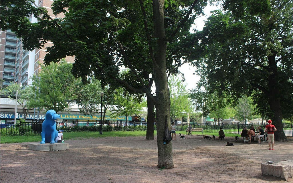 Statue of a blue dog at Allan Gardens Small Dog Park - an Off-Leash Dog Park in Toronto / East York Area. 