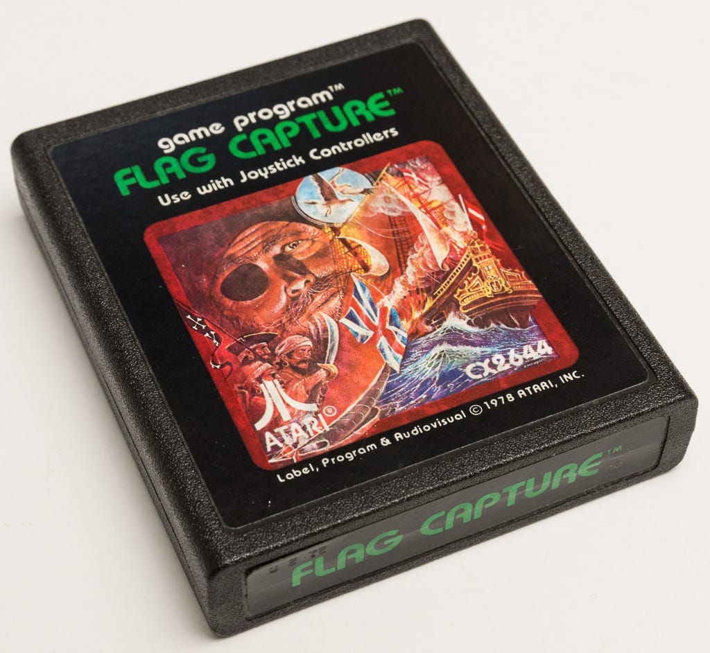 A photo of a rare Atari Inc. Flag Capture picture label game cartridge.