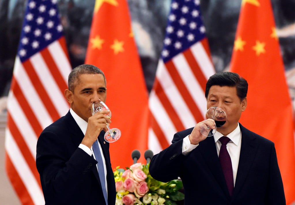 U.S. President Barack Obama (L) and Chinese President Xi Jinping have a drink after a toast at a lunch banquet in the Great Hall of the People in Beijing November 12, 2014. Obama is on a state visit after attending the Asia-Pacific Economic Cooperation summit.  REUTERS/Greg Baker/Pool    (CHINA - Tags: POLITICS) - RTR4DTFJ