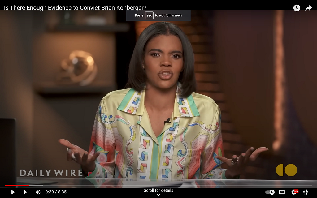 A screenshot from Candace Owens’s show on The Daily Wire. The silky blouse she’s in is kind of psychedelic, with gradient colours and a variety of different patterns. Some of the shapes on it are block-like and others are swirls. The dominant colour shown is a lemon-lime mix, with red, blue and spearmint green.