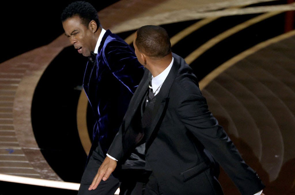 Will Smith slapping Chris Rock across the face at the Academy awards 2022