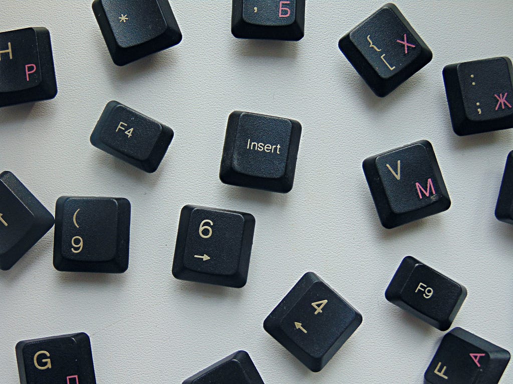 Random black keyboard keys scattered around