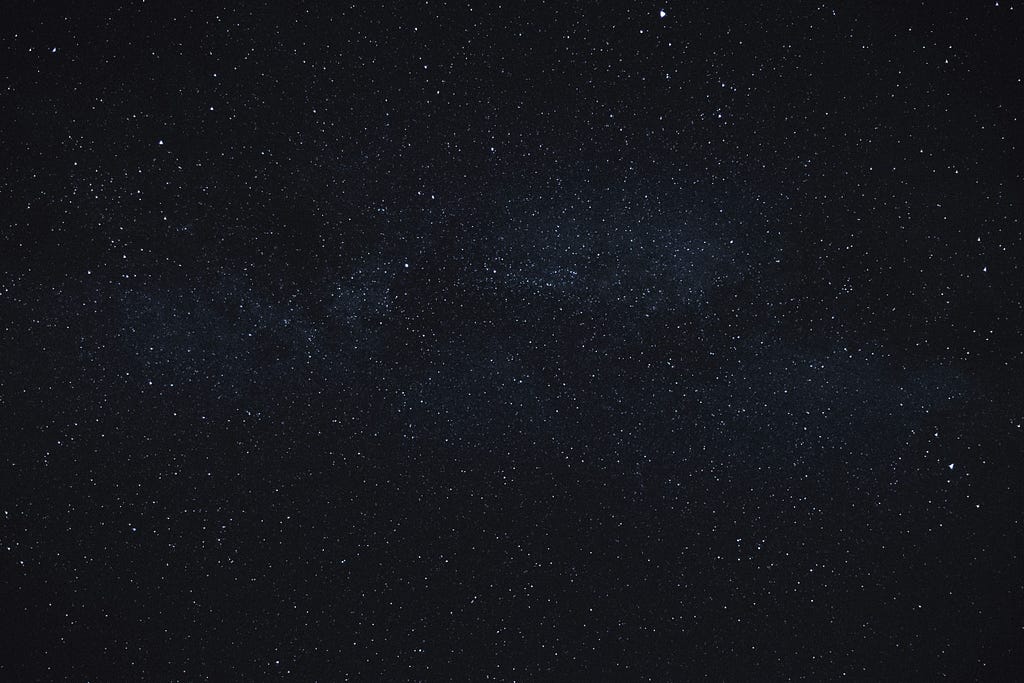 A picture of stars with mostly black space.