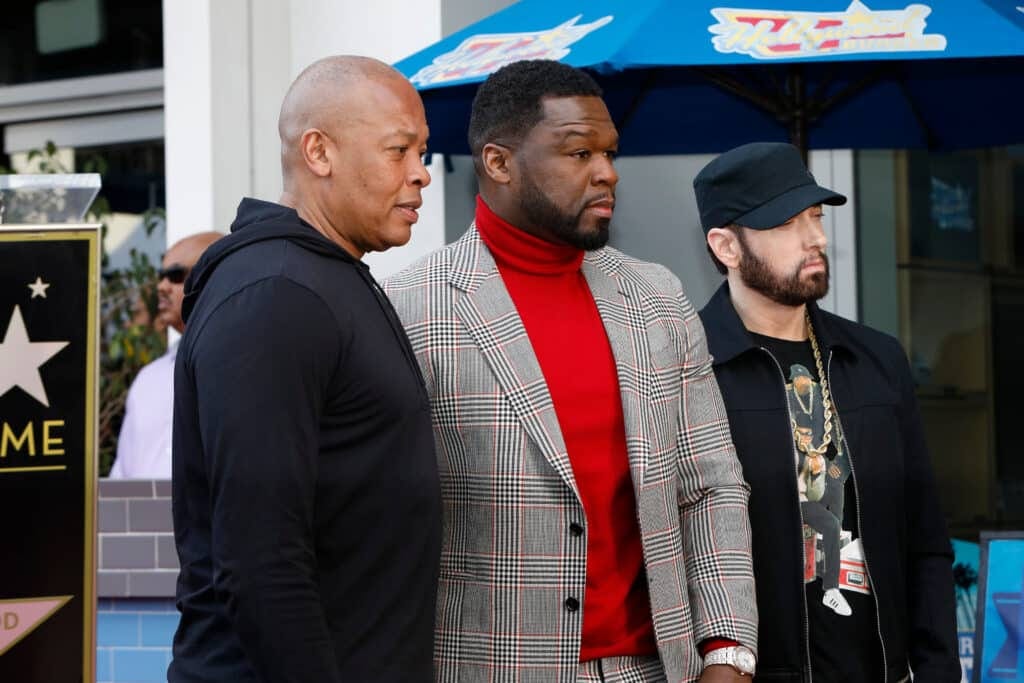 From left: Dr. Dre, 50 Cent, and Eminem at 50’s Star ceremony. Credit: Shutterstock/Kathy Hutchins