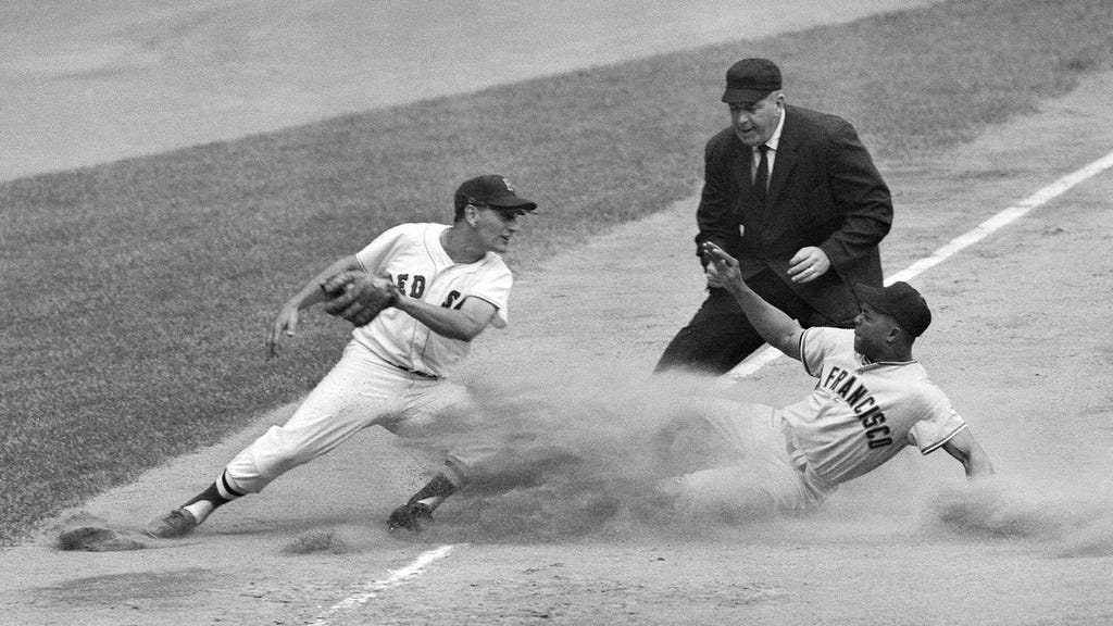 Willie Mays — former San Francisco Giants Baseball Star — slides into base.
