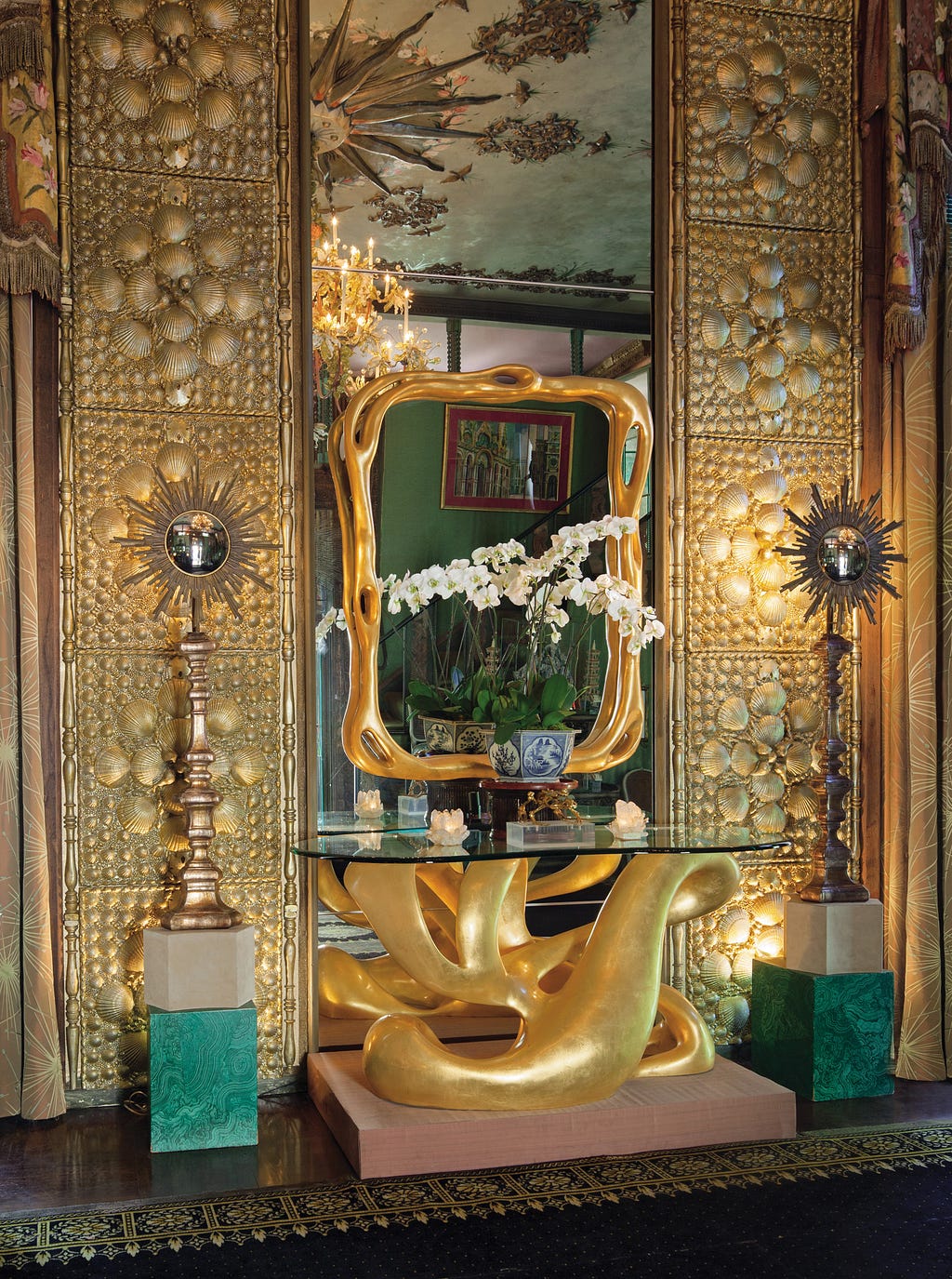 Gold panels and mirror by Tony Duquette. Also, a gold resin stand.