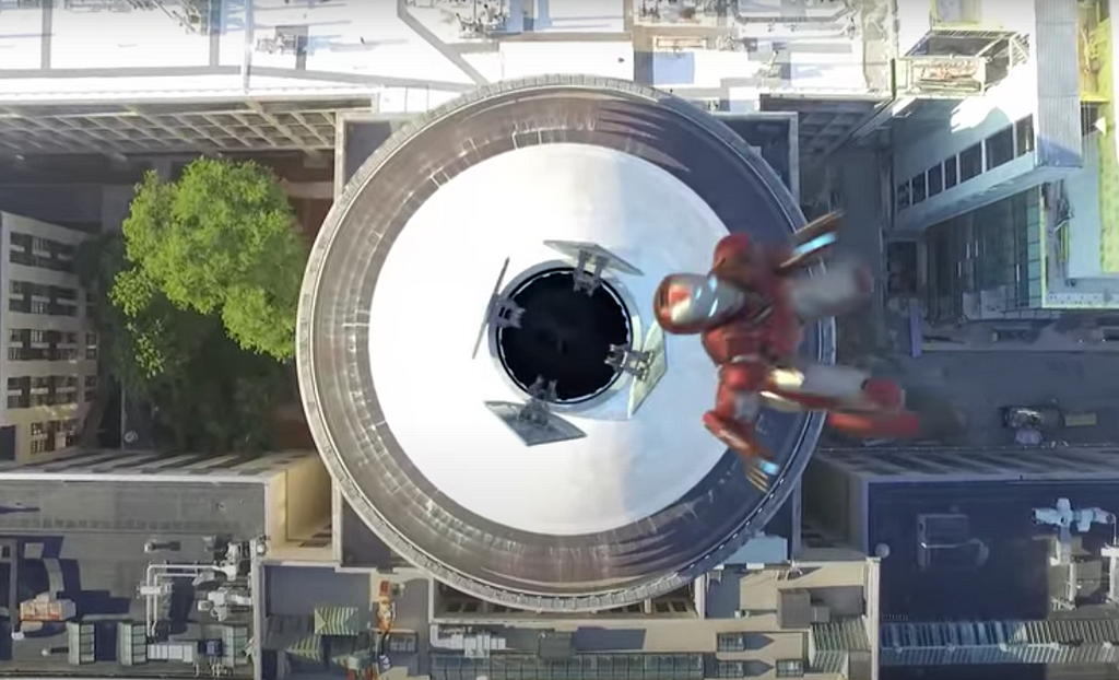 Aerial photo of RiRi Williams in her IronHeart suit flying over the top of MIT’s Great Dome.