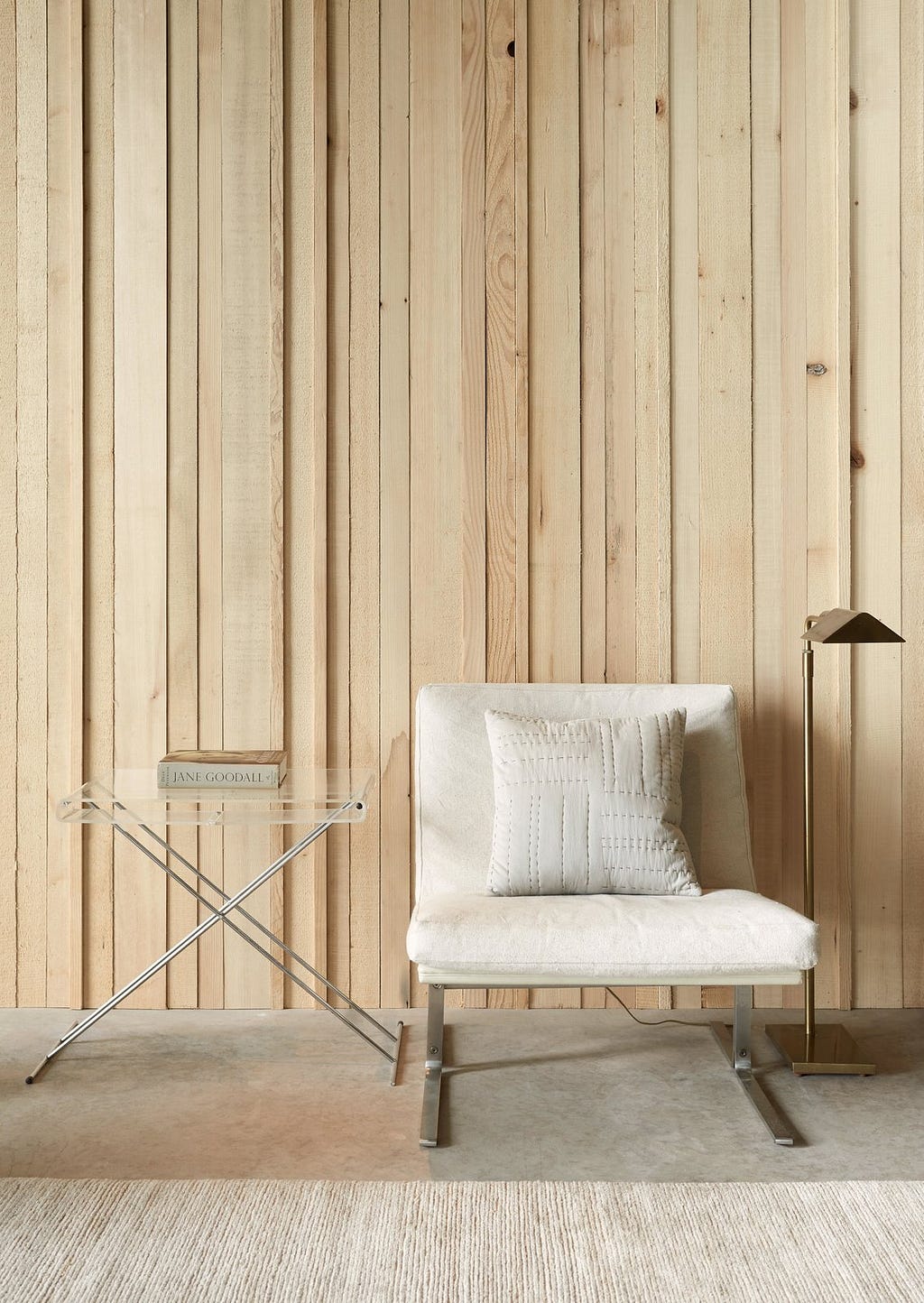 Living Room, Floor Lighting, Chair, End Tables, Concrete Floor, and Rug Floor A Mesmerizing Cabin in Puget Sound Evolves Over Several Decades - Photo 9 of 11 -