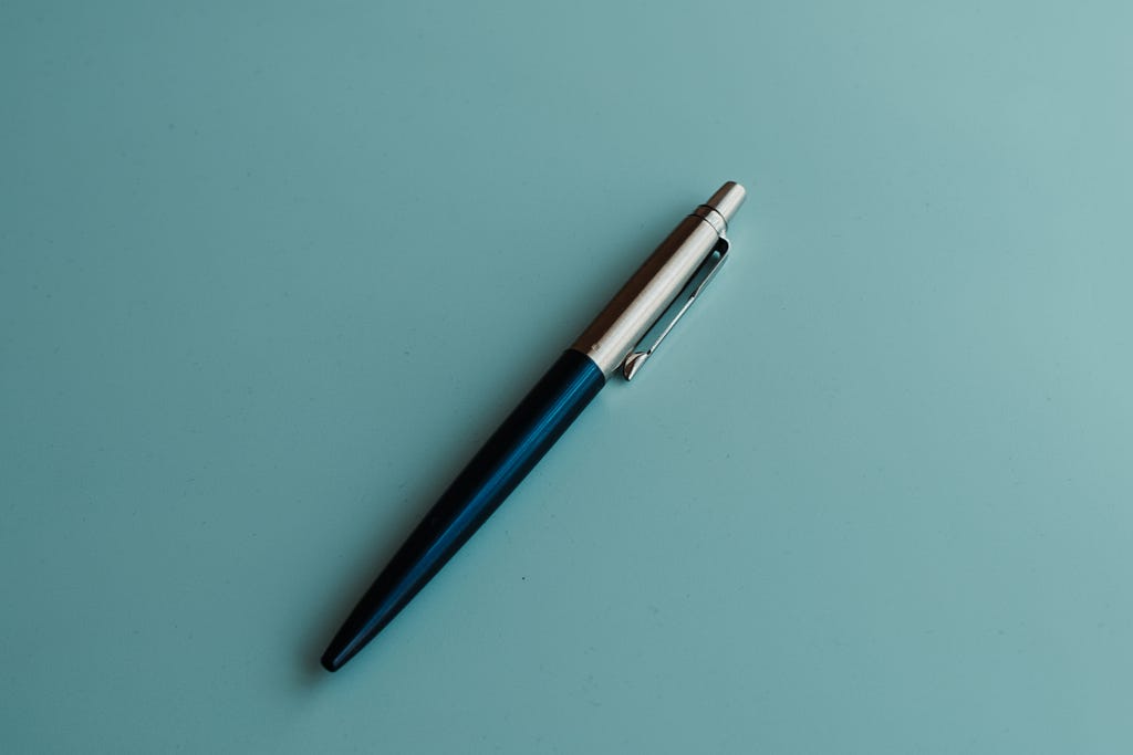 Pen on a blue background