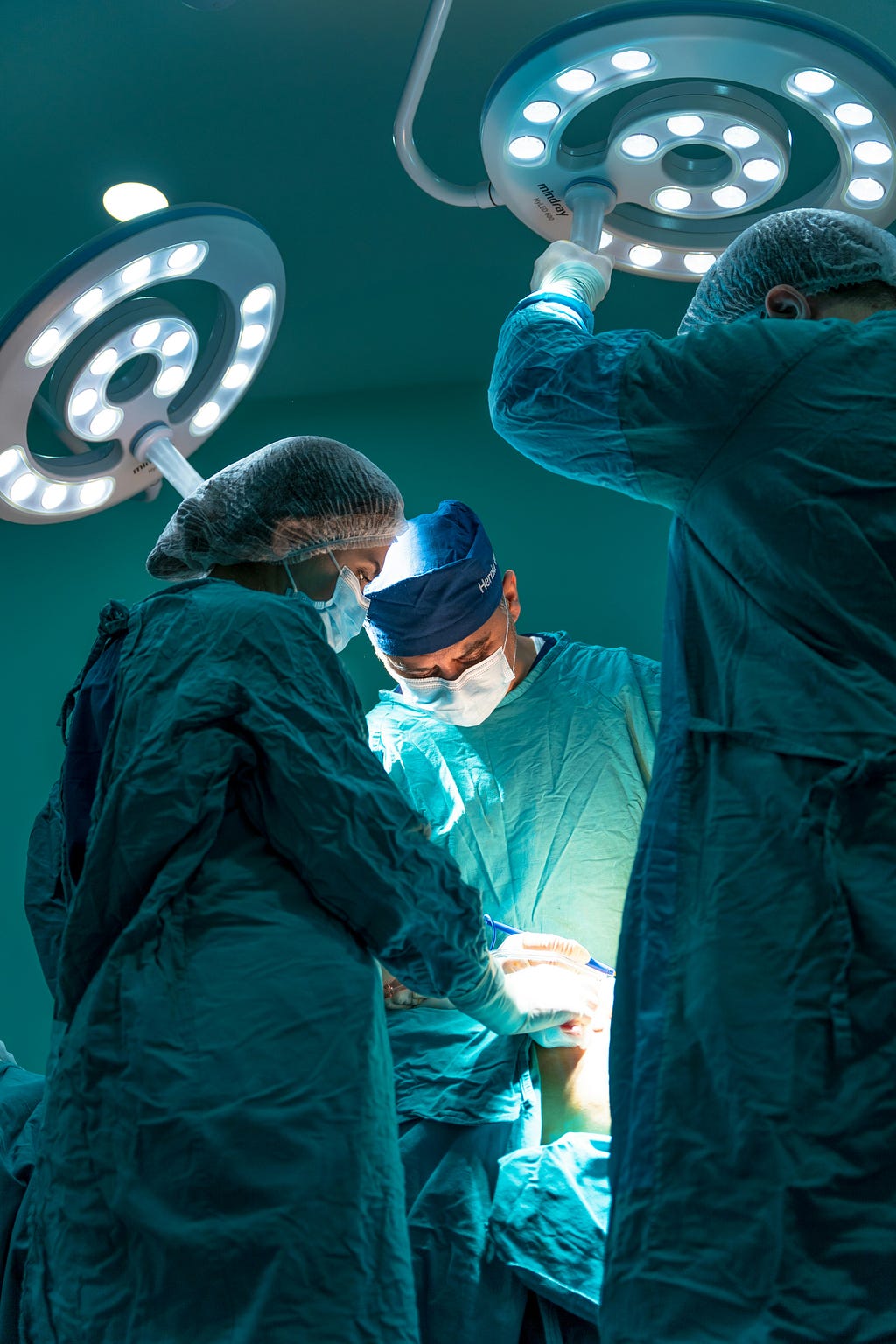 Doctors operating on a patient.