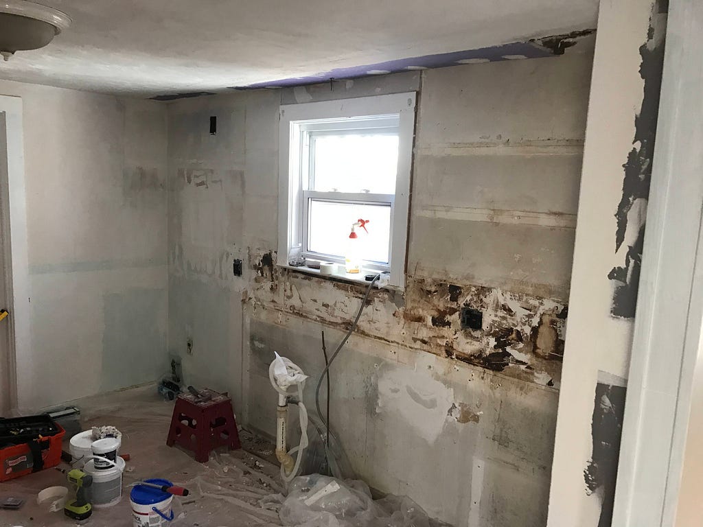 Should You Plaster behind Kitchen Units: Essential Insights