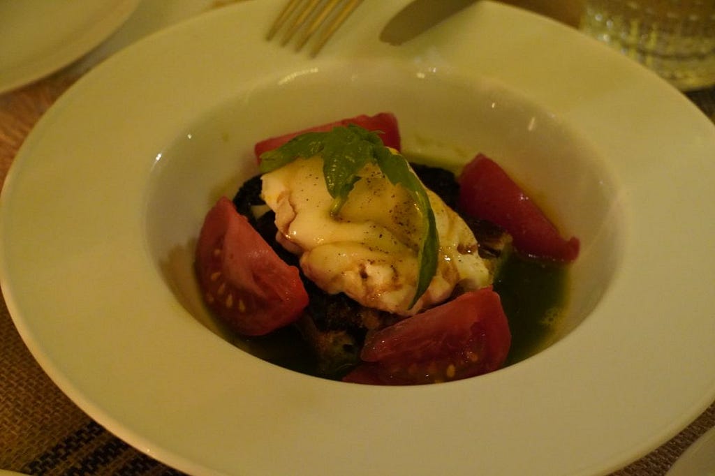 burrata, tomato salad, charred bread, balsamic vinegar at Summer of Ludo & Giles Montage Beverly Hills