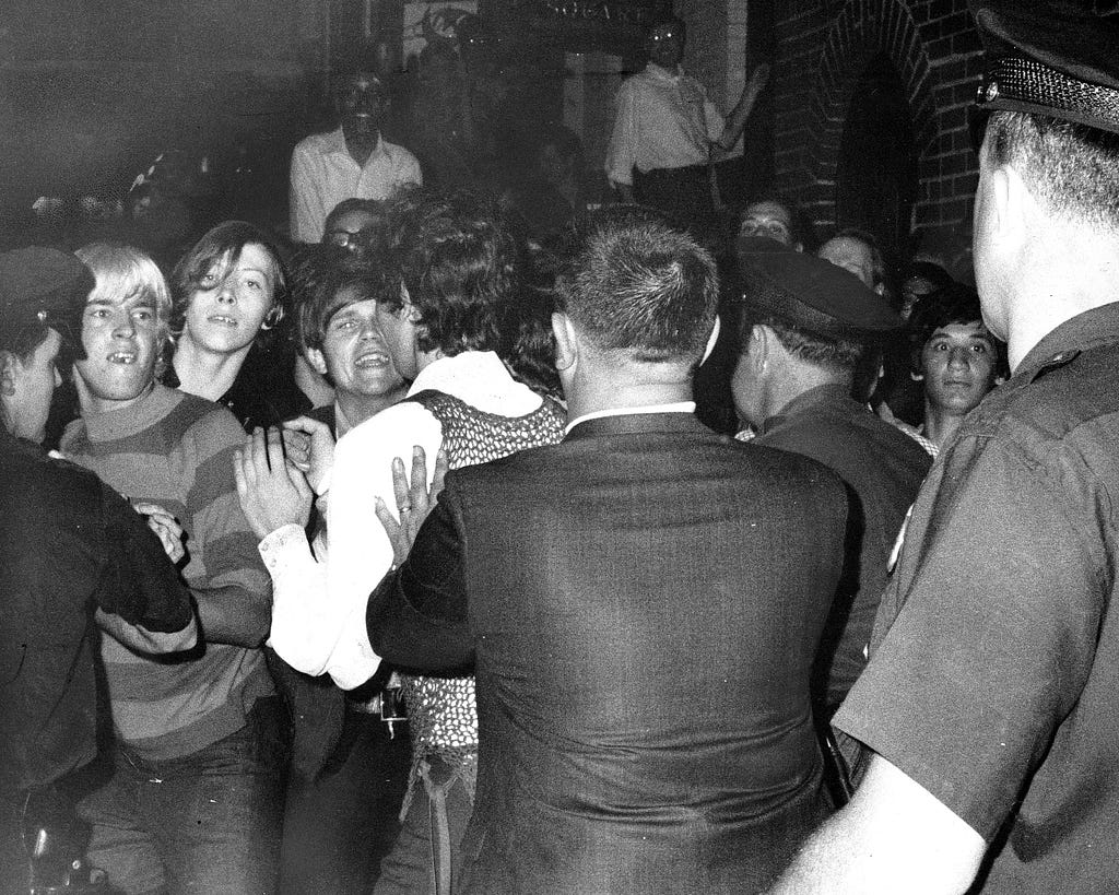 UNITED STATES - JUNE 28: Stonewall Inn nightclub raid. Crowd attempts to impede police arrests outside the Stonewall Inn on Christopher Street in Greenwich Village. (Photo by NY Daily News Archive via Getty Images)
