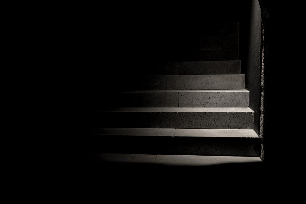 A staircase hidden in shadows.