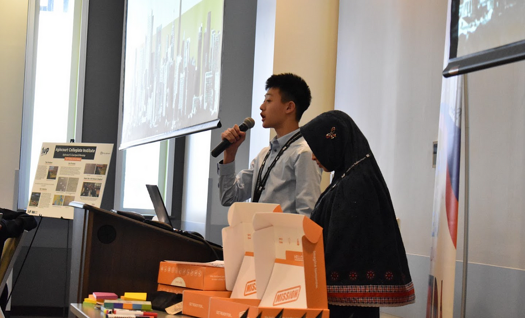 Two students pitch their plans for the redesign of a space at their school.