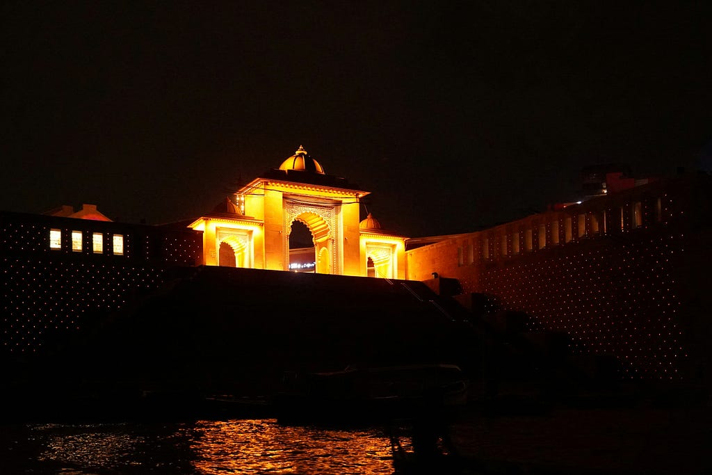 kashi vishwanath temple beside ganga river at night