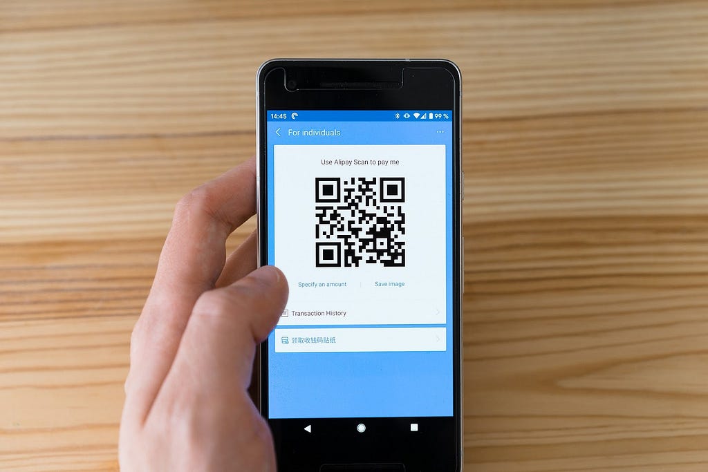 A user making payment through mobile payment app