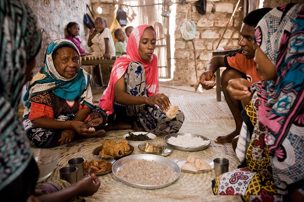 The Mohammed family serves lunch
at their coral stone house in the fishing village of Kipangani. | © James Fisher 2017 All Rights Reserved.