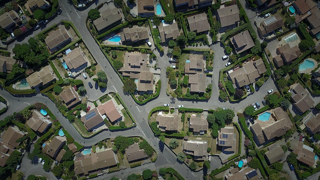 An overview of a suburban neighborhood, complete with three culdesacs and winding roads.