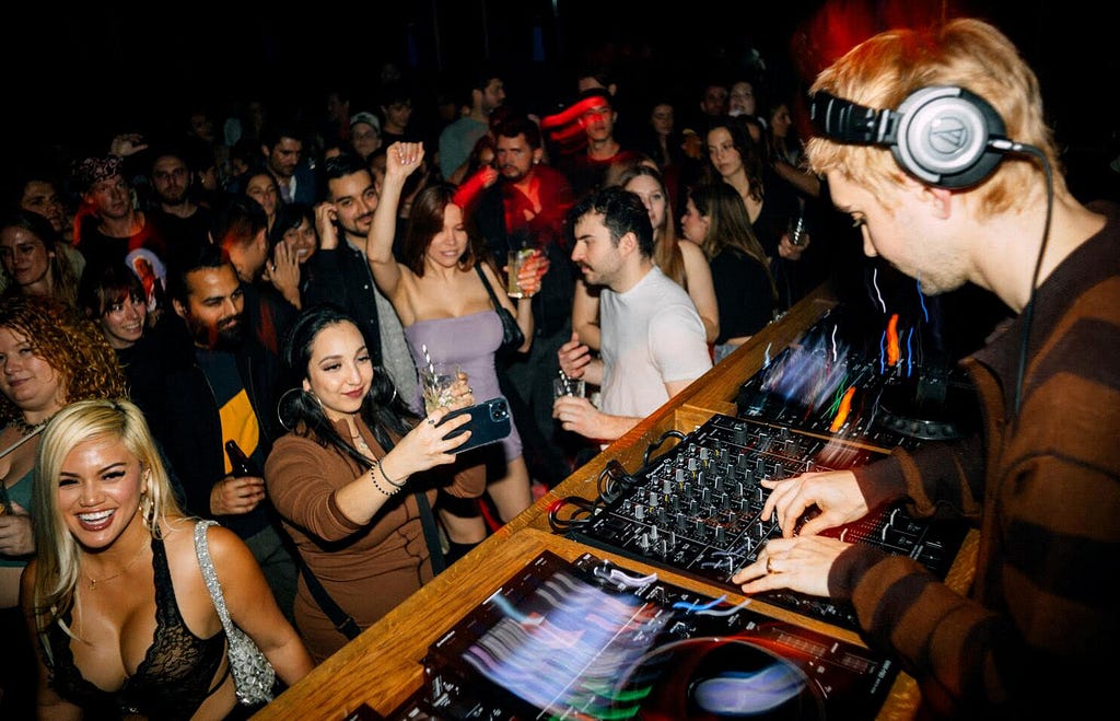 Image of DJ and crown inside of an LA Club