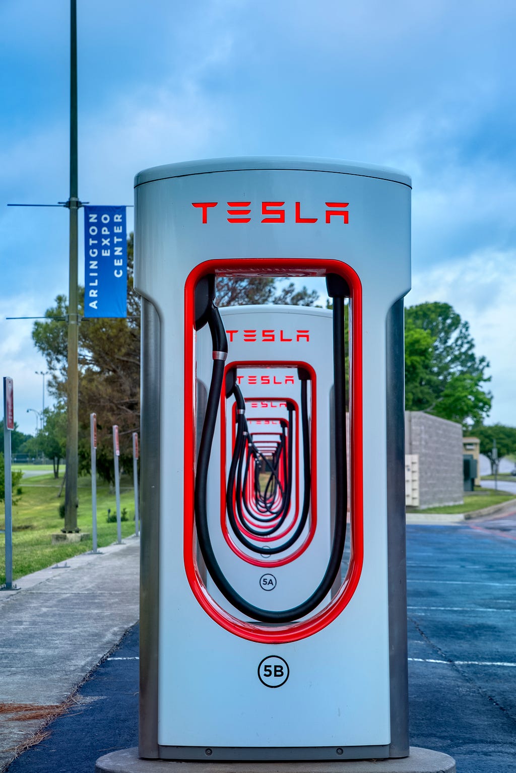 A row of Tesla SuperCharger charging stations.