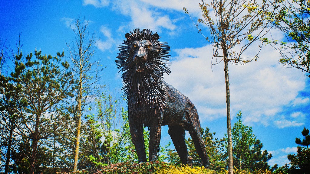 Statue of lion with mane like porcupine quills