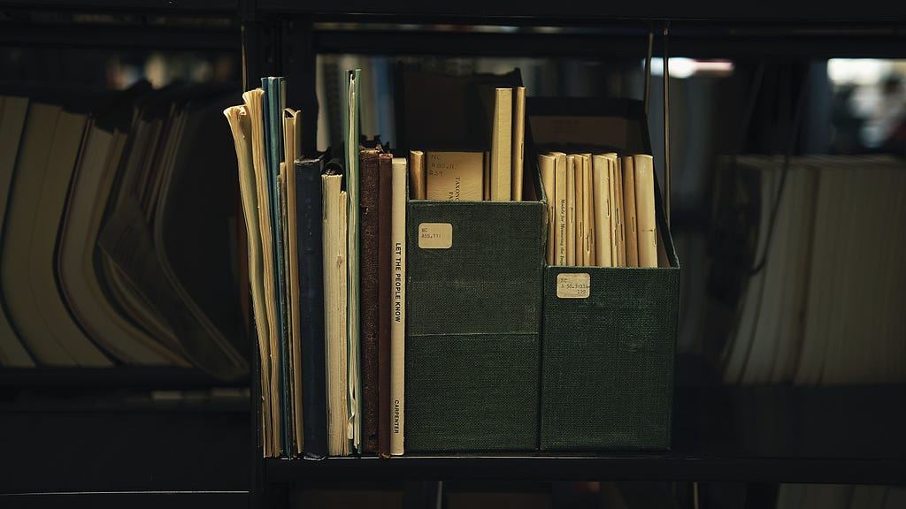 a stack of books from the shelves of a vintage bookstore