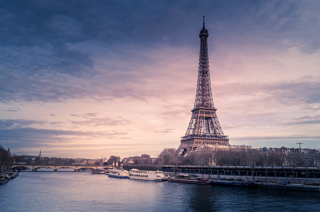 A picture of the eiffel tower from across a body of water