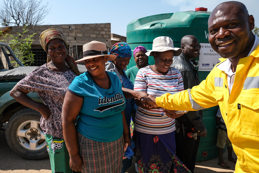 Simon Khoza delivering JoJos (water tanks) to community members in Agincourt, South Africa, as part of Variant Bio’s benefit-sharing program