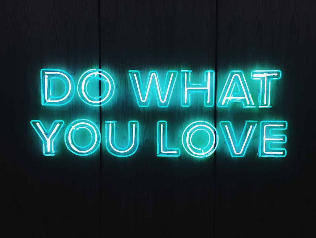 Neon sign stating “Do what you love”